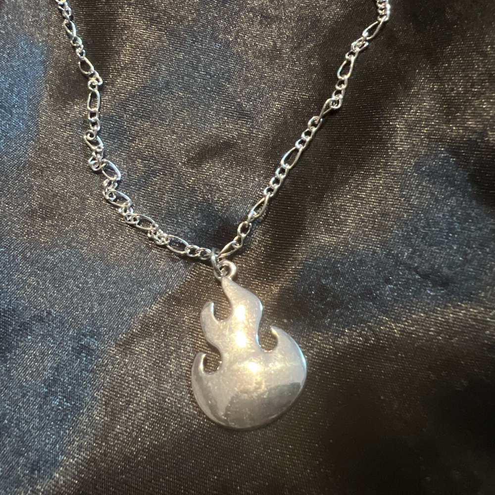 Silvertone flame necklace
